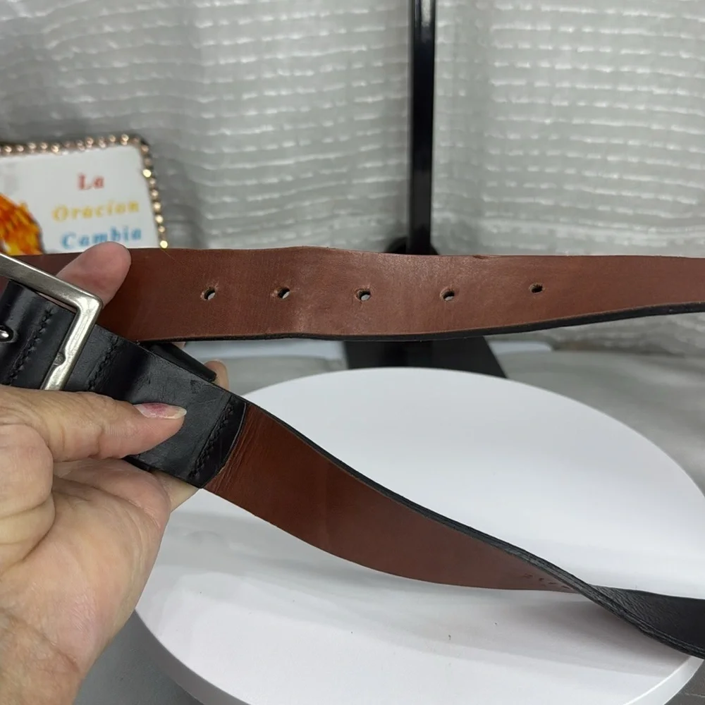 (H)Two Pebble Beach boys' leather belts with black and white metal silve buckles